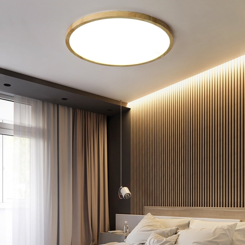 Modern bedroom with a ceiling light fixture and striped wall.